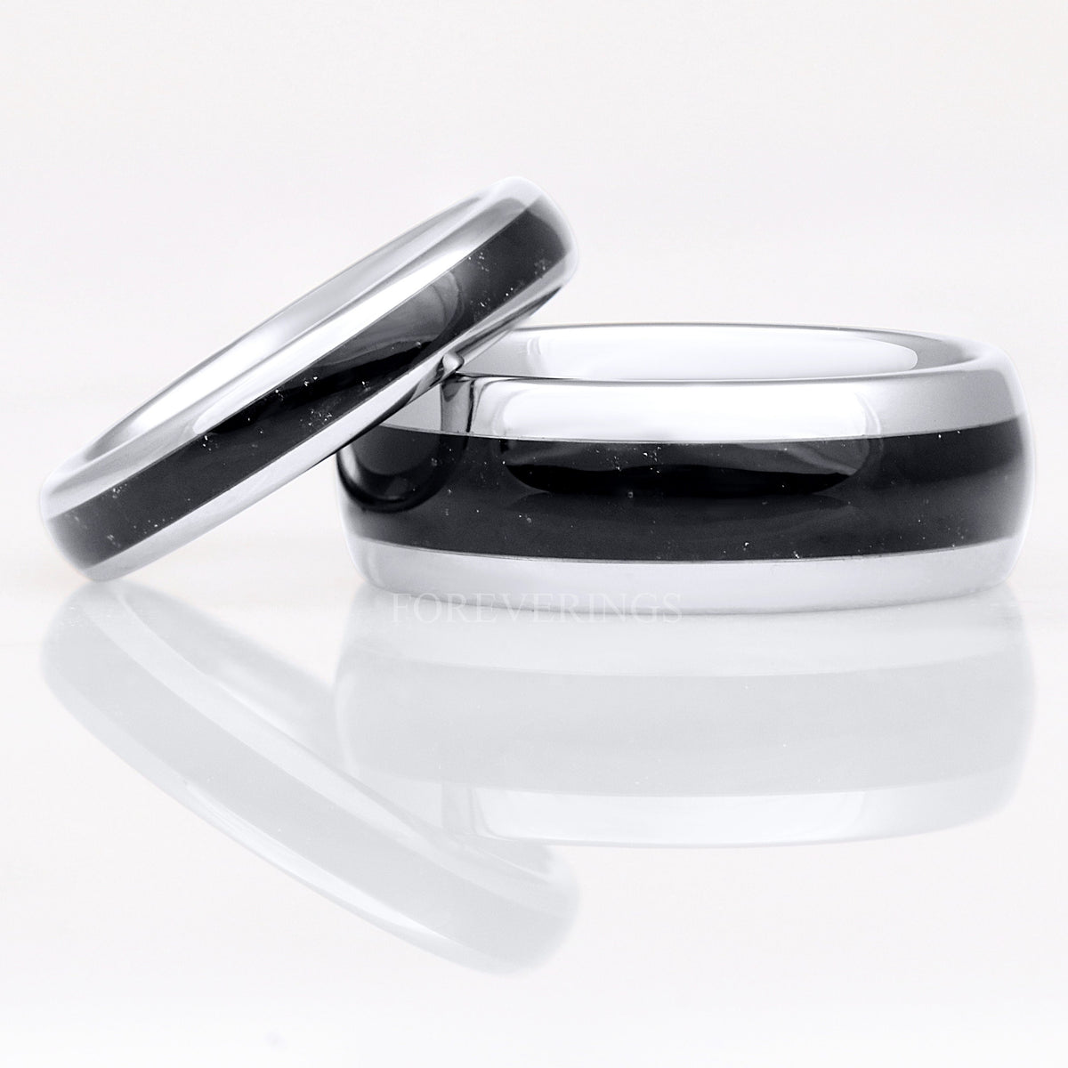 Silver tungsten black onyx rings, a narrow ring leaning on the 8mm band
