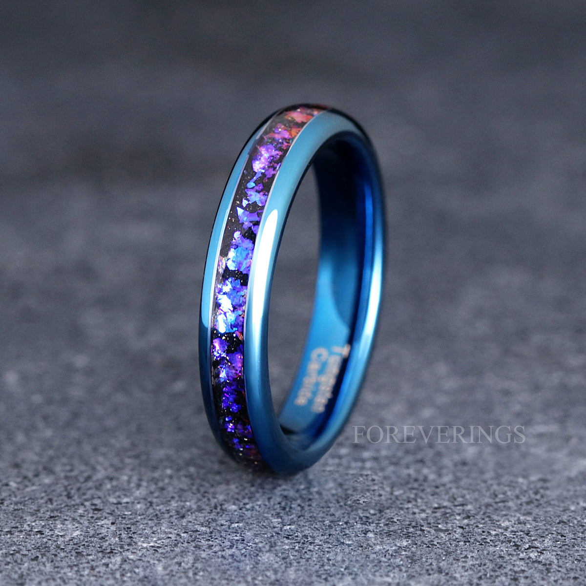 Women's 4mm blue tungsten ring with blue and purple sandstone inlay, standing upright