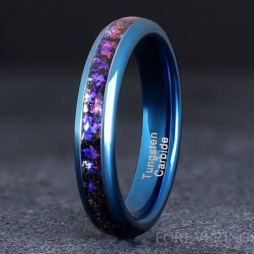 4mm blue tungsten ring with Orion nebula sandstone inlay, close-up standing view