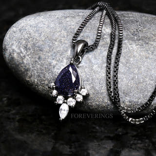Black rhodium sterling silver Great Rift necklace with a pear blue sandstone pendant on a box chain