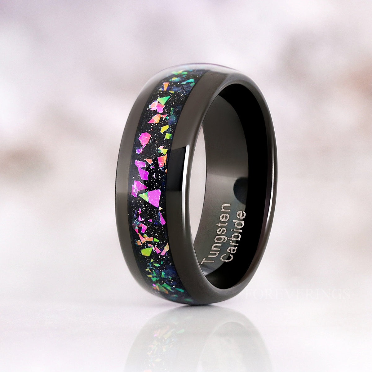 His 8mm black tungsten band with supernova flake inlay, angled to show the polished interior