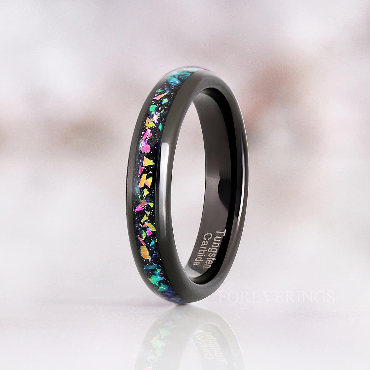 Black tungsten supernova band standing upright at an angle, reflection below