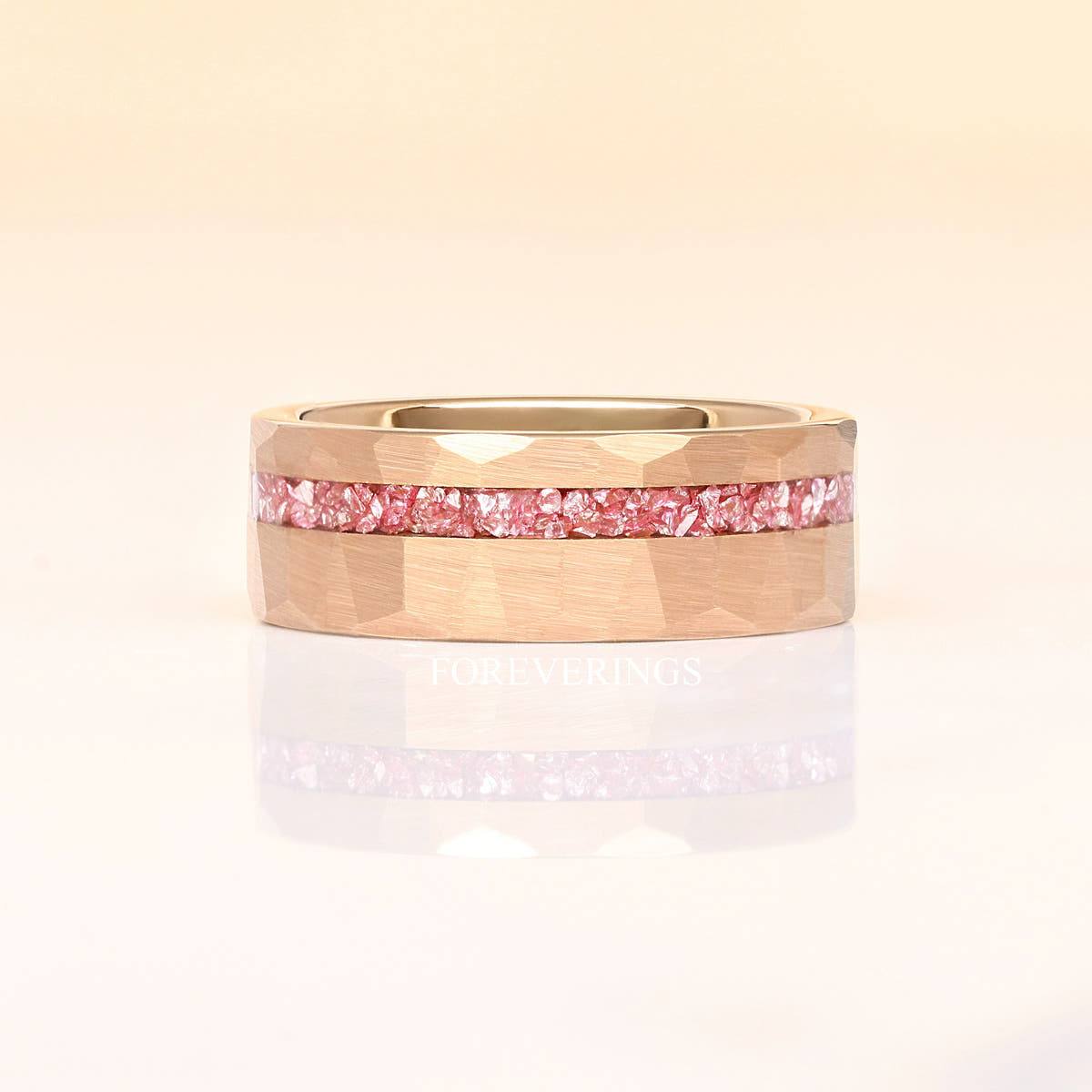 Hammered rose gold tungsten morganite band lying flat, shown straight on with a reflection