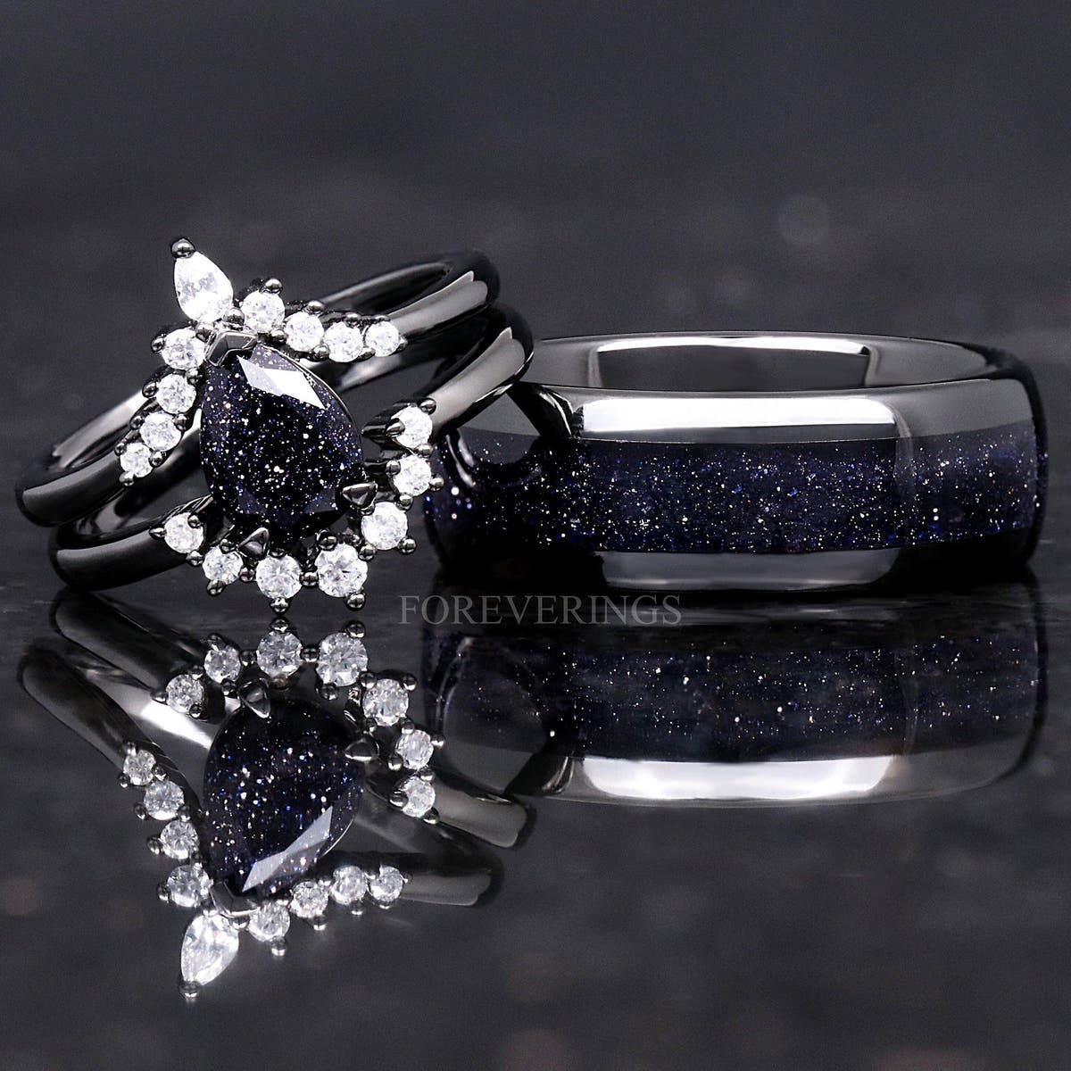 Matching black couples ring set with a pear blue sandstone engagement ring and 8mm tungsten band