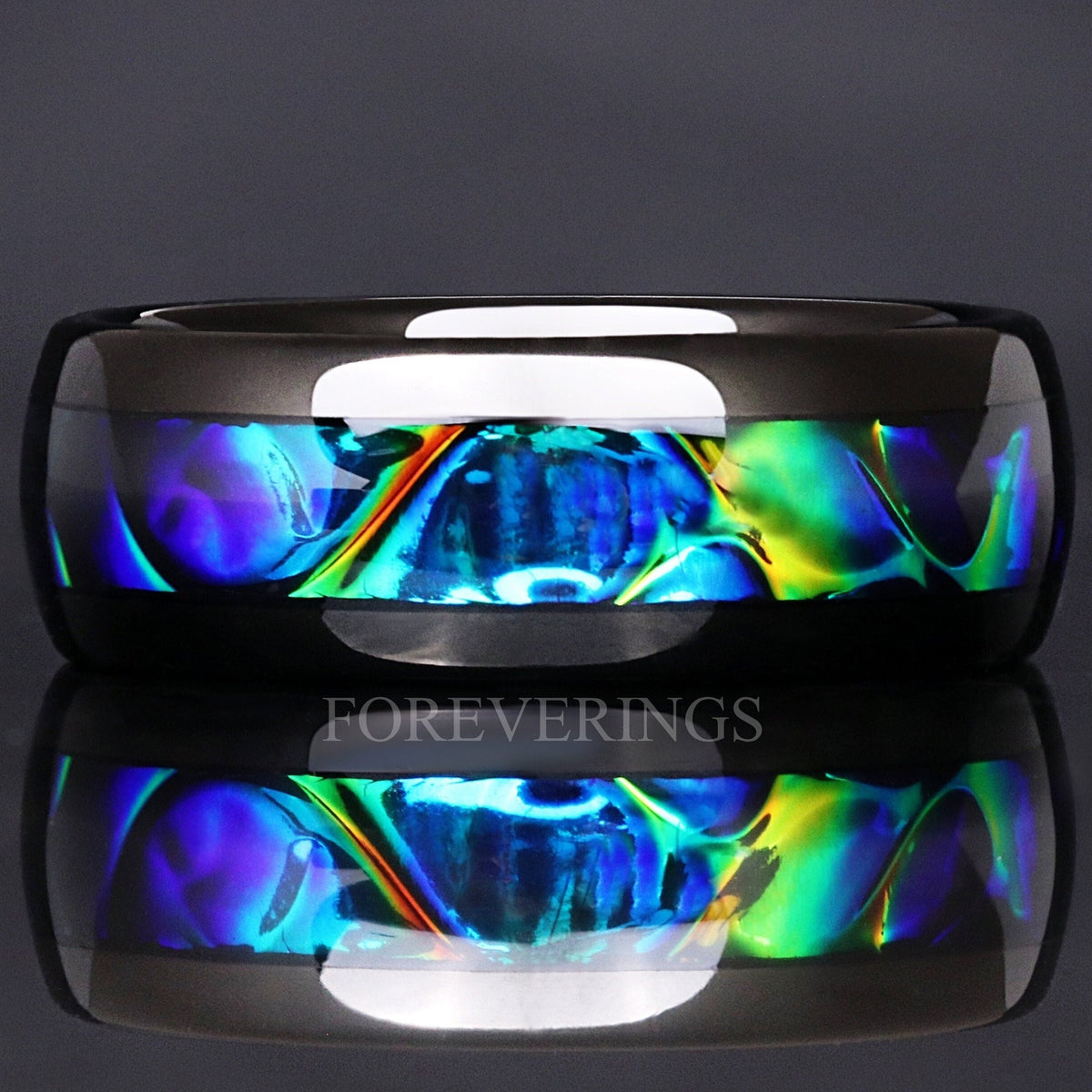8mm black tungsten wedding band with color-shifting azure dichrolam inlay, shown straight on