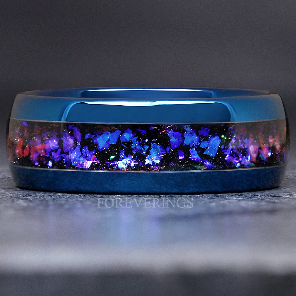 Men's 8mm blue tungsten wedding band with Orion nebula sandstone inlay, shown straight on