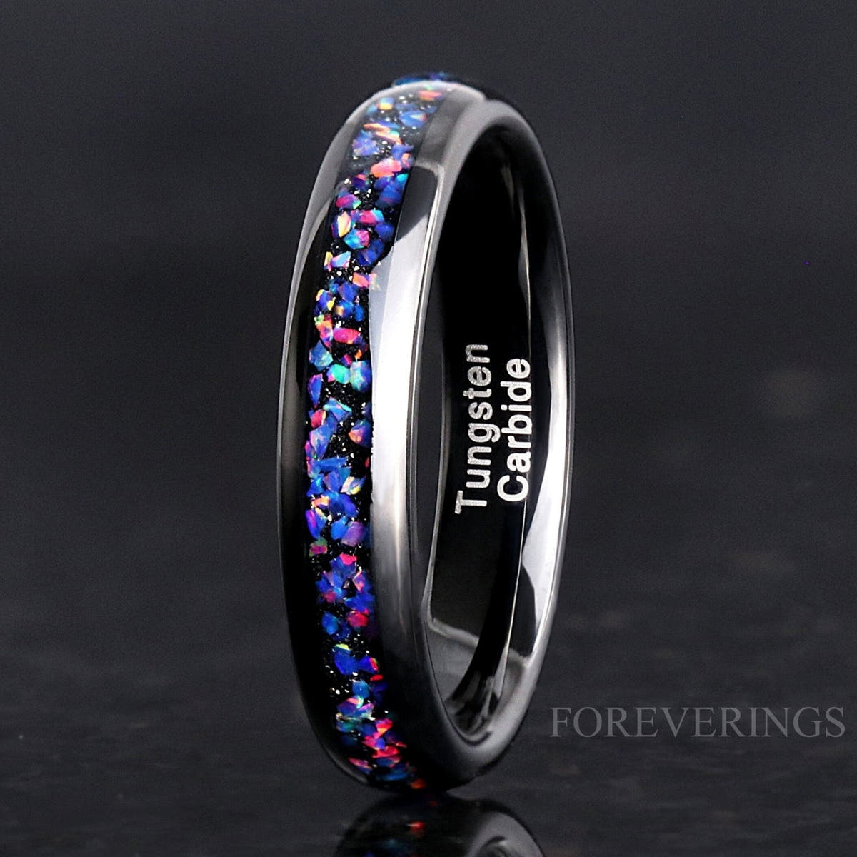 4mm black tungsten ring with Van Gogh opal inlay, standing on edge