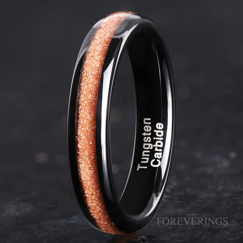 4mm black tungsten ring with Carina Nebula red sandstone inlay, standing upright