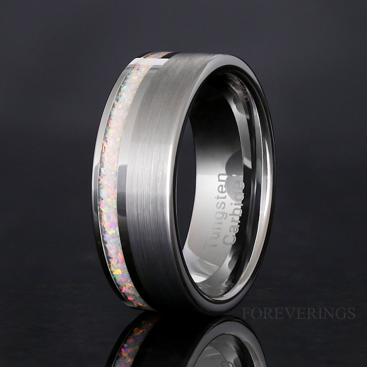 Men's 8mm matte silver tungsten ring with an offset white fire opal strip, standing upright