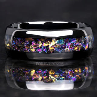 Black tungsten wedding ring with crushed moonstone inlay in Veil nebula colors, polished dome