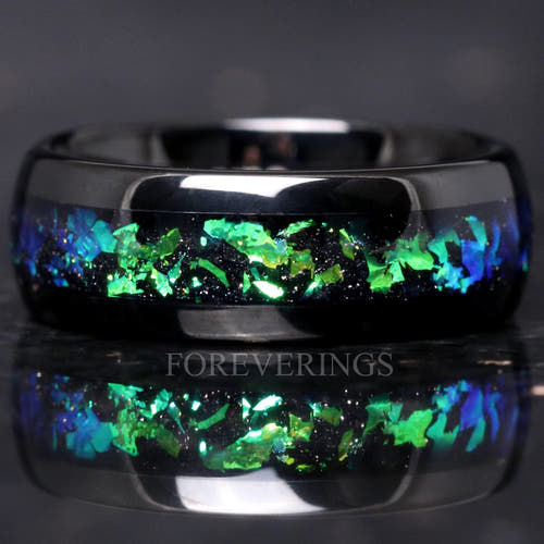 Black tungsten ring with green and blue Rosette nebula inlay, close front view with reflection