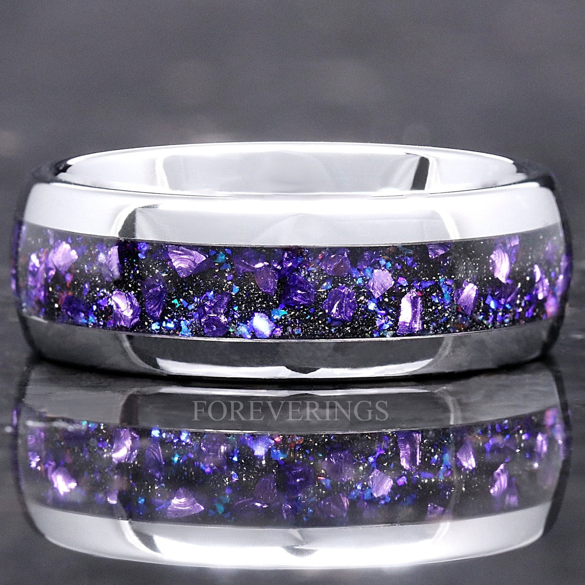 Silver tungsten wedding band with Crab nebula alexandrite and purple sandstone inlay, close front view