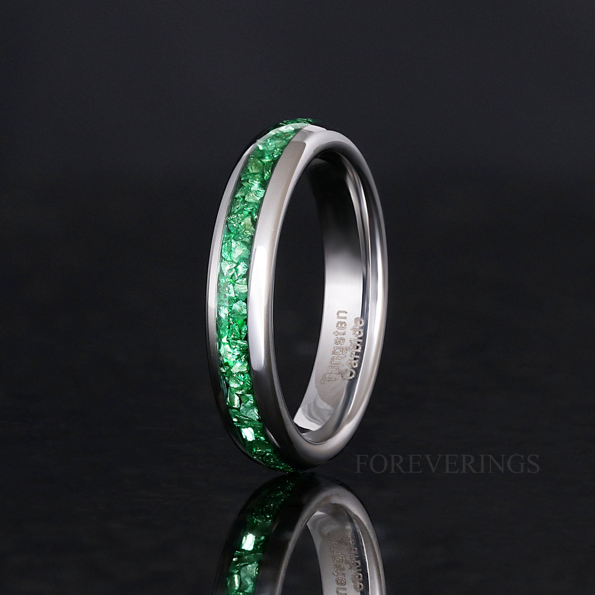 Women's 4mm silver tungsten ring with emerald inlay, standing upright