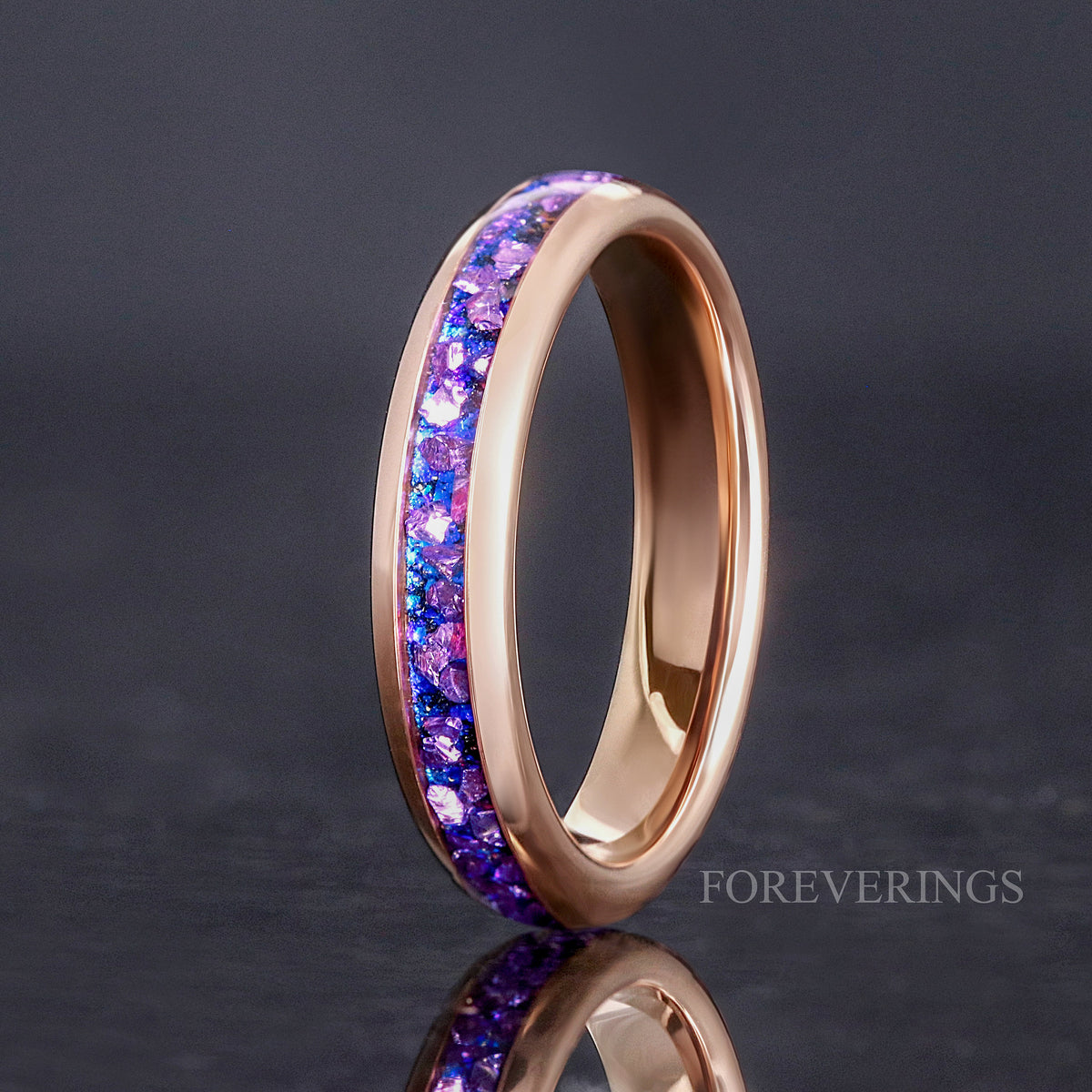 4mm rose gold tungsten ring with alexandrite inlay, standing on edge