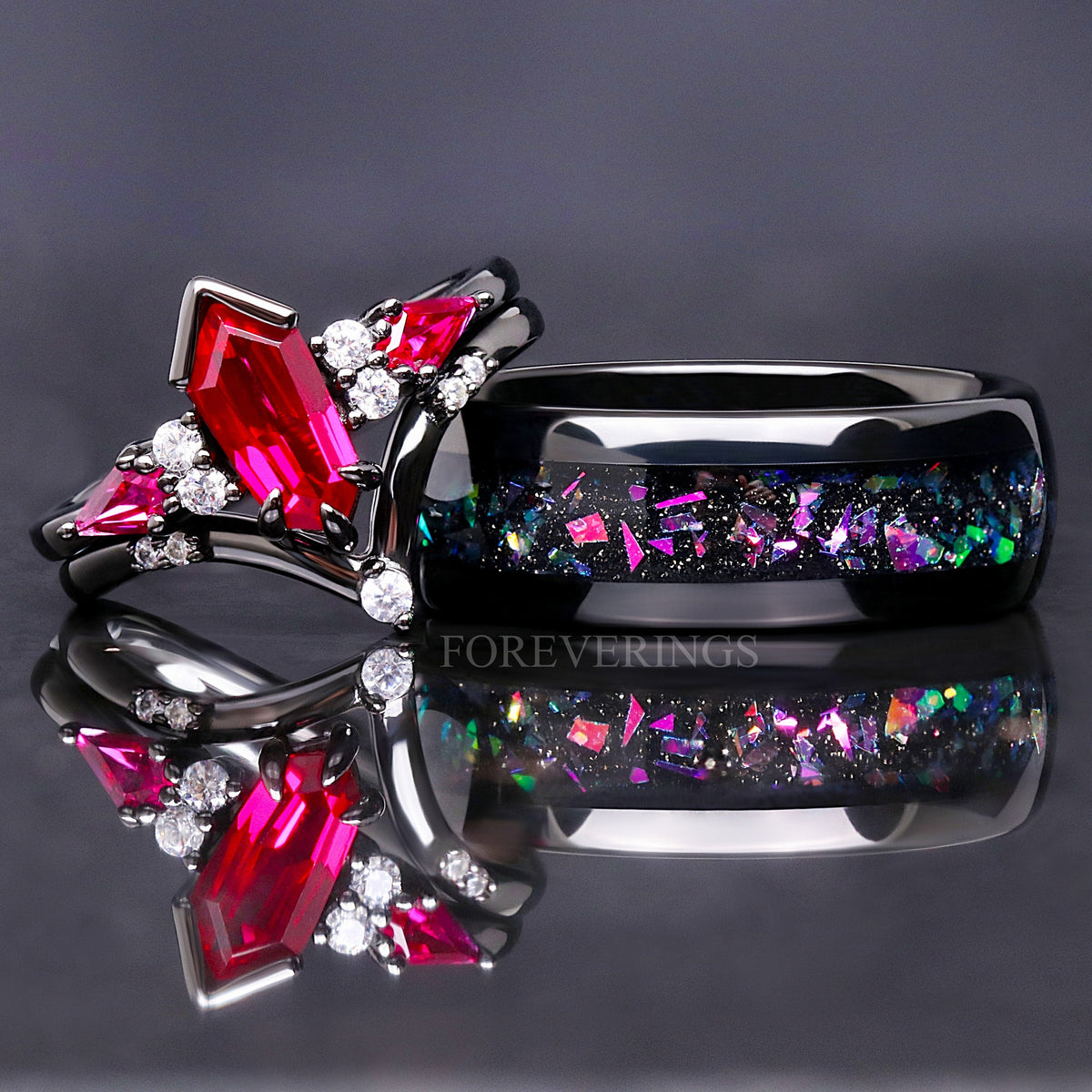 Matching black couples ring set: ruby engagement ring and 8mm tungsten band with supernova-inspired inlay