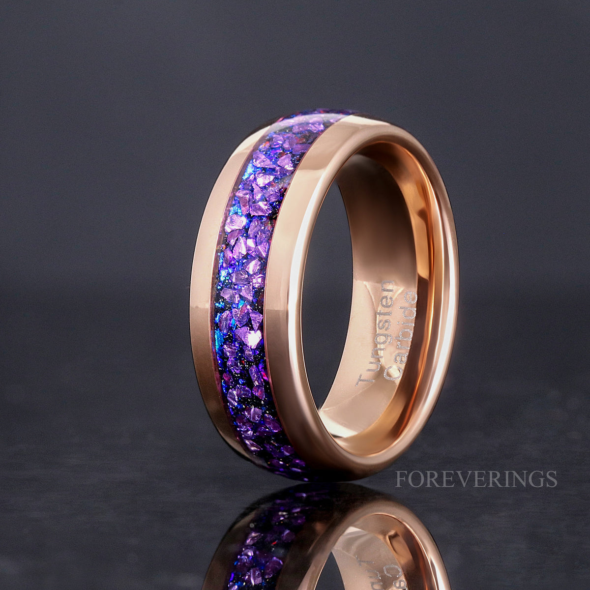 8mm rose gold tungsten ring with alexandrite inlay, standing angled to show the interior