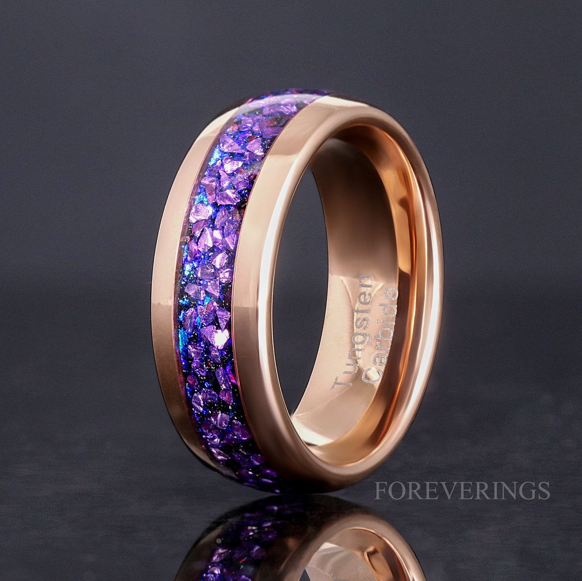 Men's 8mm rose gold tungsten band with crushed alexandrite inlay, standing to show the interior