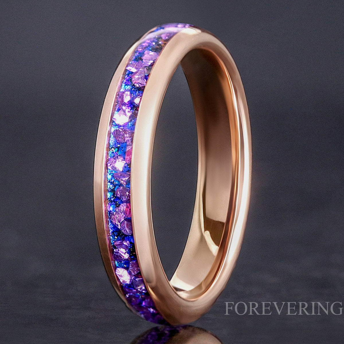 4mm rose gold tungsten ring with crushed alexandrite Crab nebula inlay, standing on edge