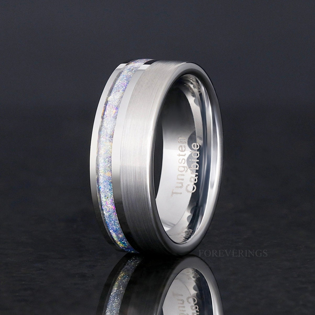 Men's moonstone inlay ring in brushed silver tungsten, standing at an angle