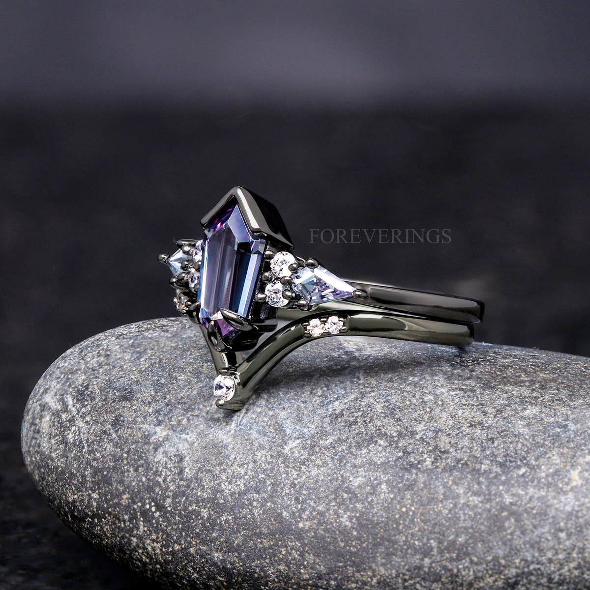 Hexagon alexandrite engagement ring and curved band in black sterling silver, angled side view