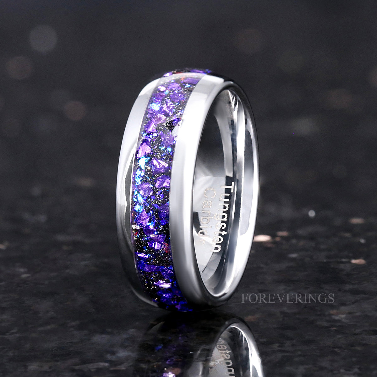 Men's 8mm silver tungsten band with alexandrite and purple sandstone inlay, standing at an angle