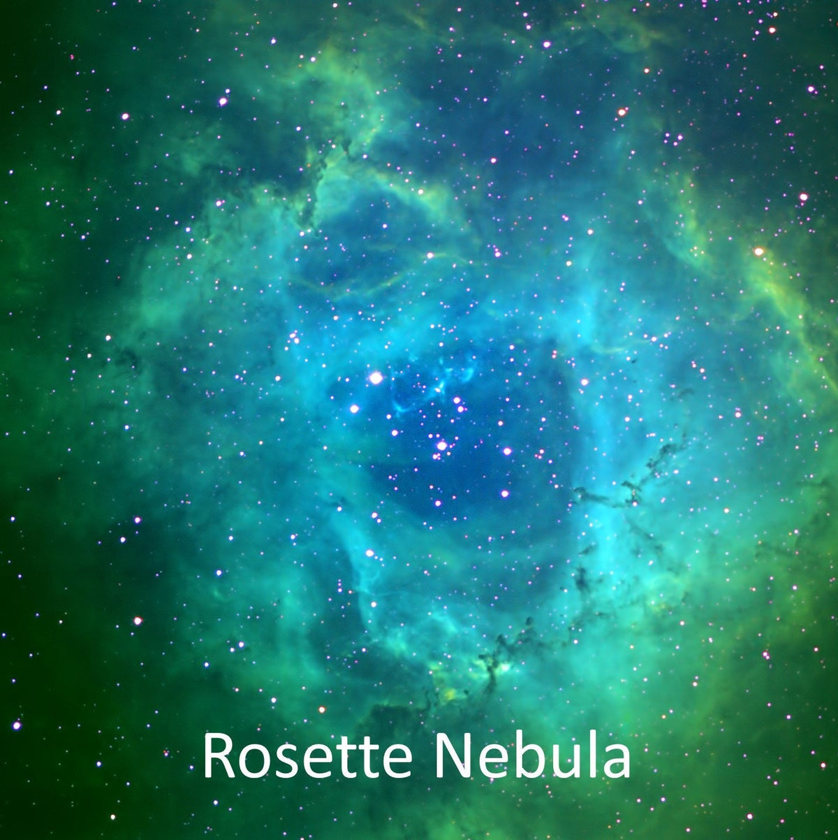 Rosette Nebula glowing green, the inspiration for the tsavorite bridal set