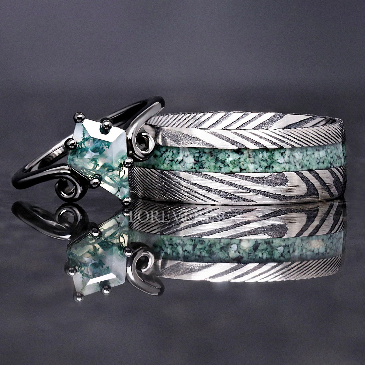 Matching couples ring set with an 8mm Damascus steel moss agate band and a black twirl moss agate ring