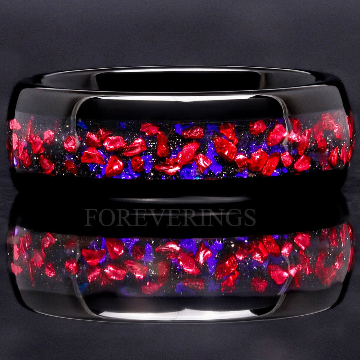 Men's 8mm black tungsten Pelican nebula band with crushed ruby and blue sandstone inlay