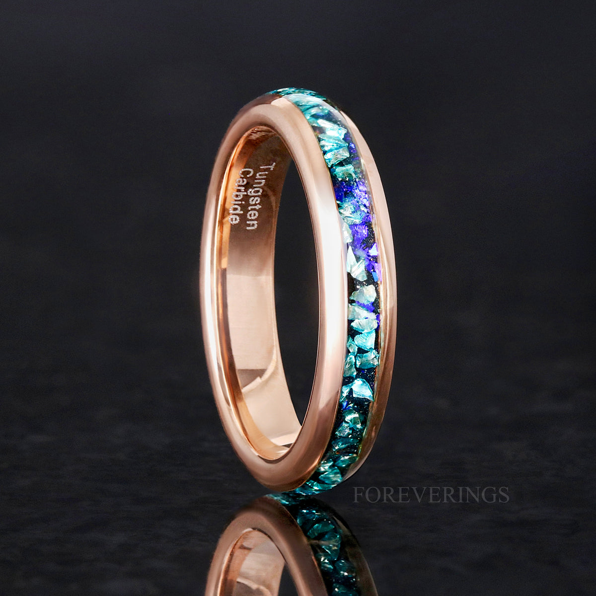 Women's 4mm rose gold tungsten ring with crushed aquamarine inlay, standing upright