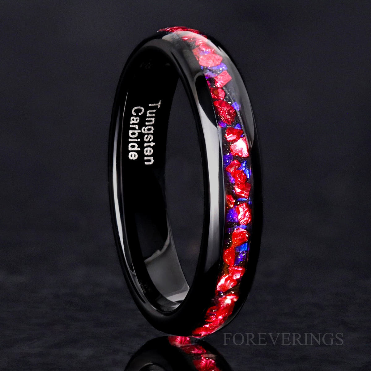 4mm black tungsten ring with Pelican nebula inlay of crushed ruby and blue sandstone, standing