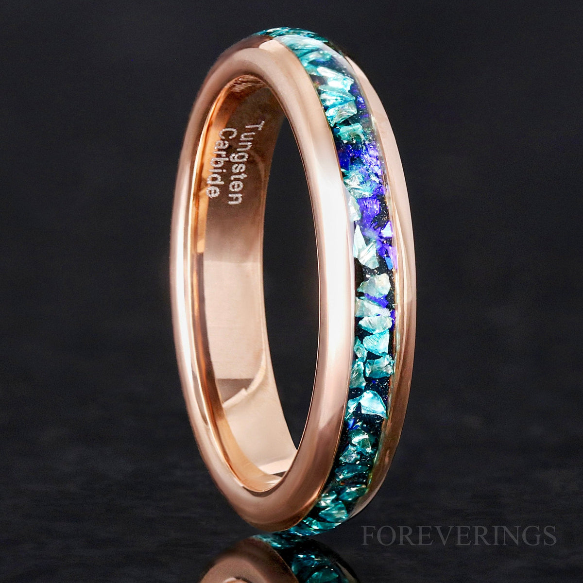 4mm rose gold tungsten ring with crushed aquamarine inlay, standing at an angle