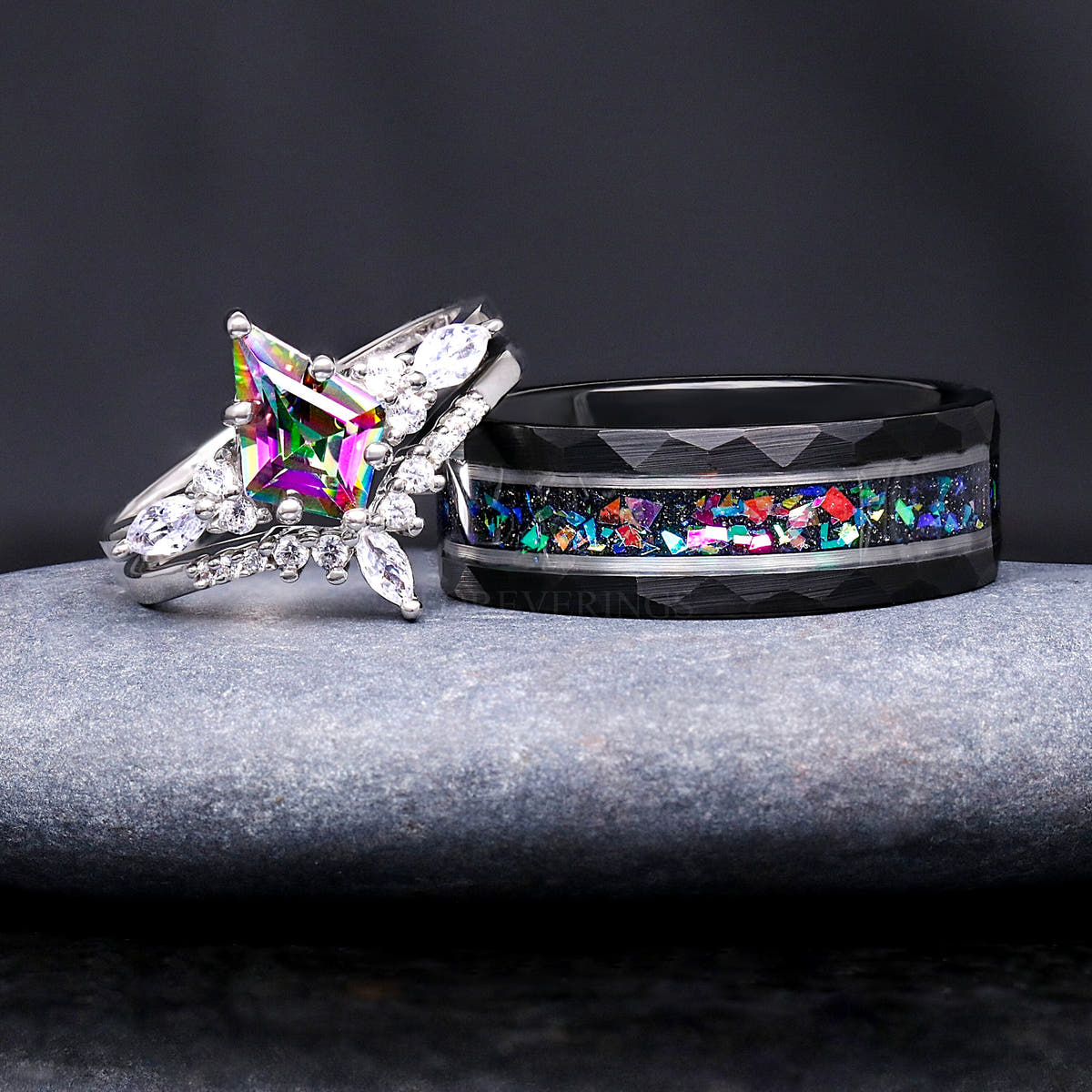 Hammered black supernova band beside a silver mystic topaz bridal set