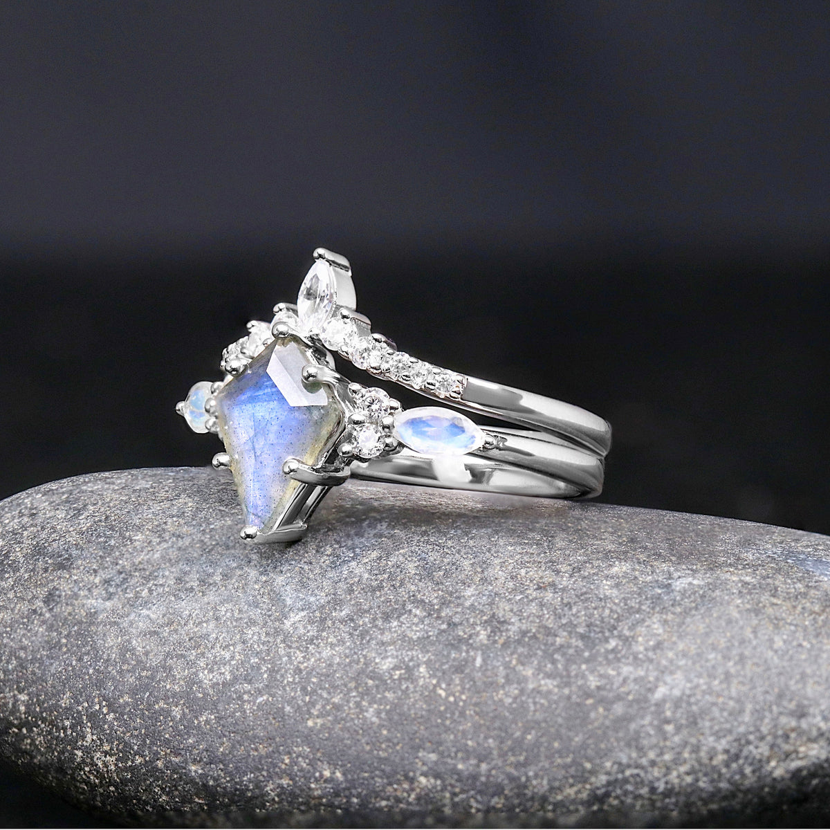 Sterling silver labradorite engagement ring and curved band, angled side view