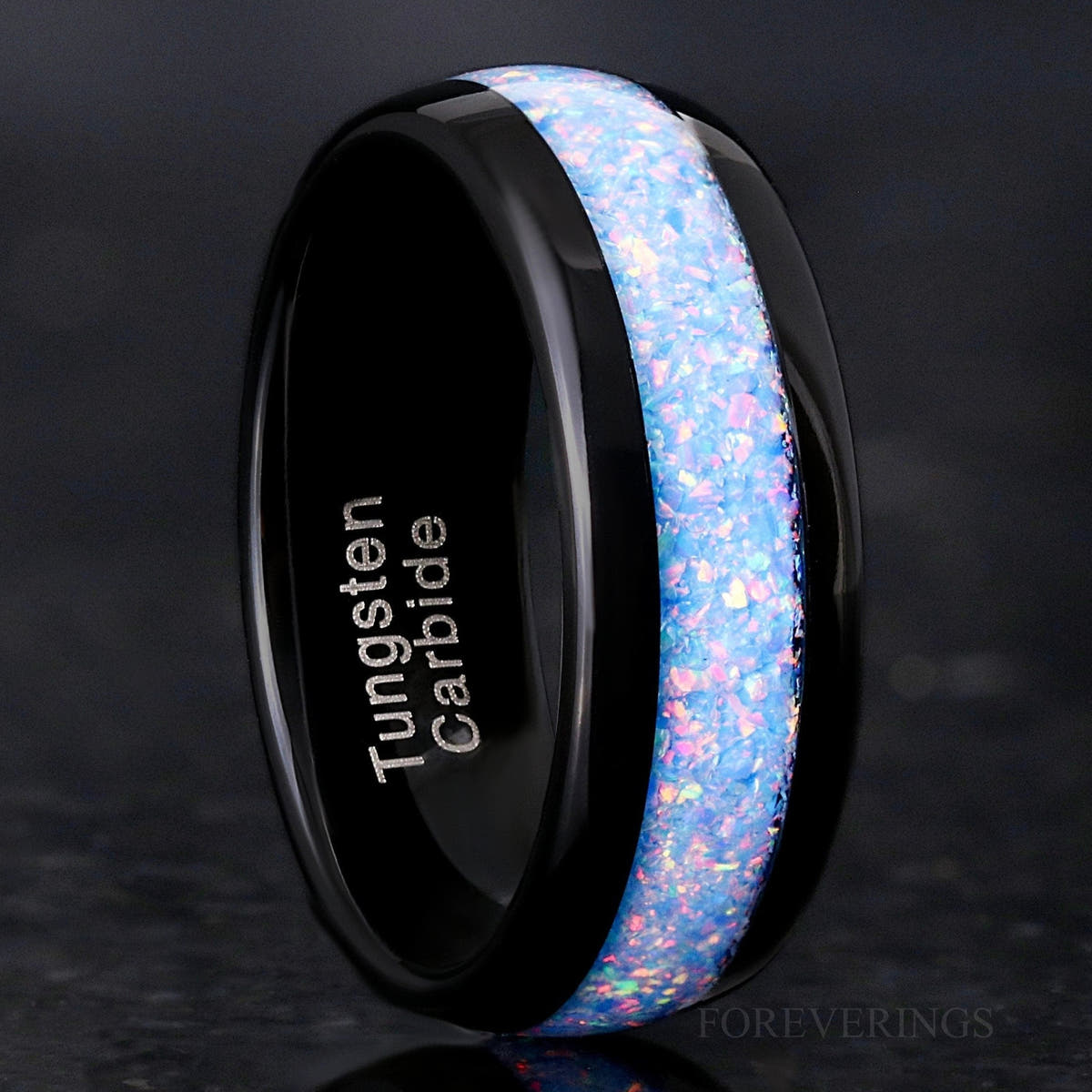 Men's 8mm black tungsten ring with rainbow fire opal inlay, angled to show the interior
