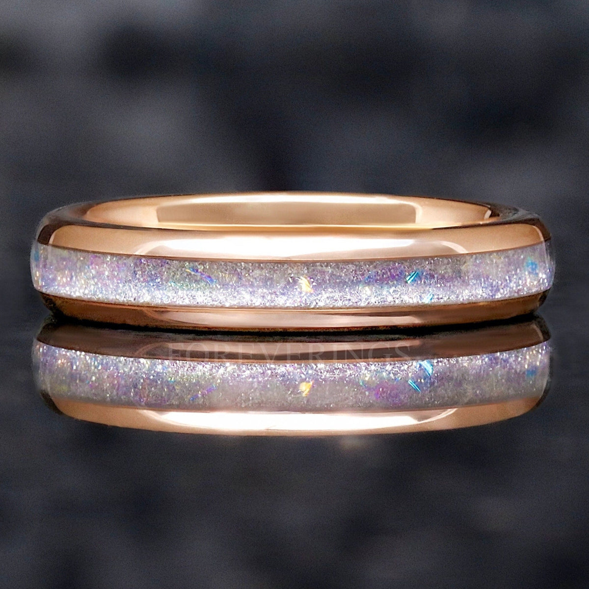 4mm rose gold tungsten wedding ring with moonstone inlay, shown straight on with a reflection