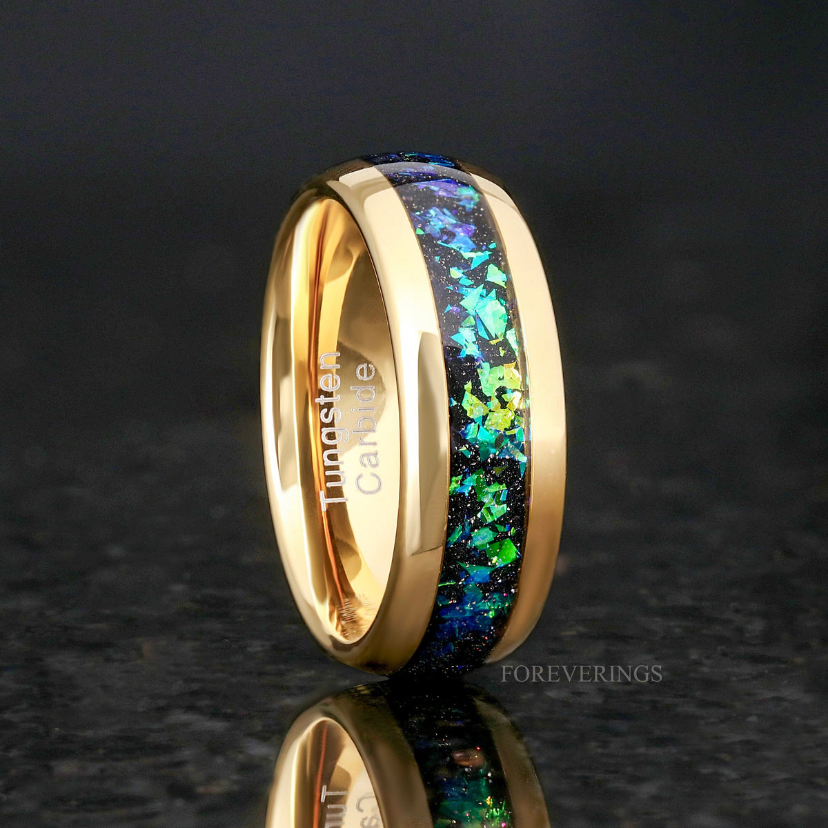 Men's 8mm gold tungsten band with green and blue nebula inlay, standing upright