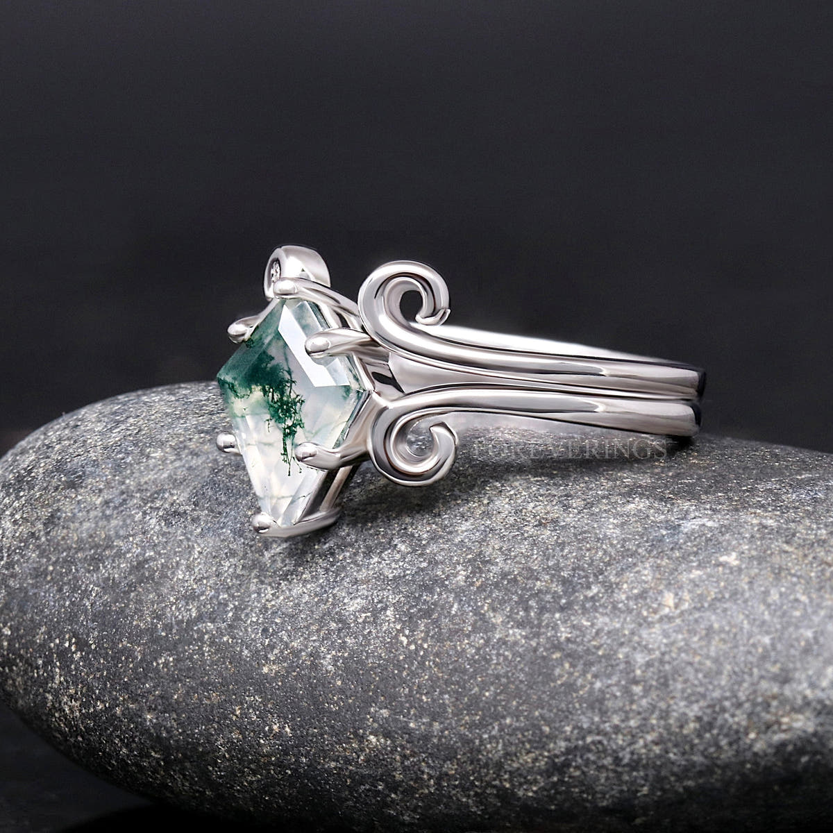 Sterling silver moss agate engagement ring and swirl band, angled side view