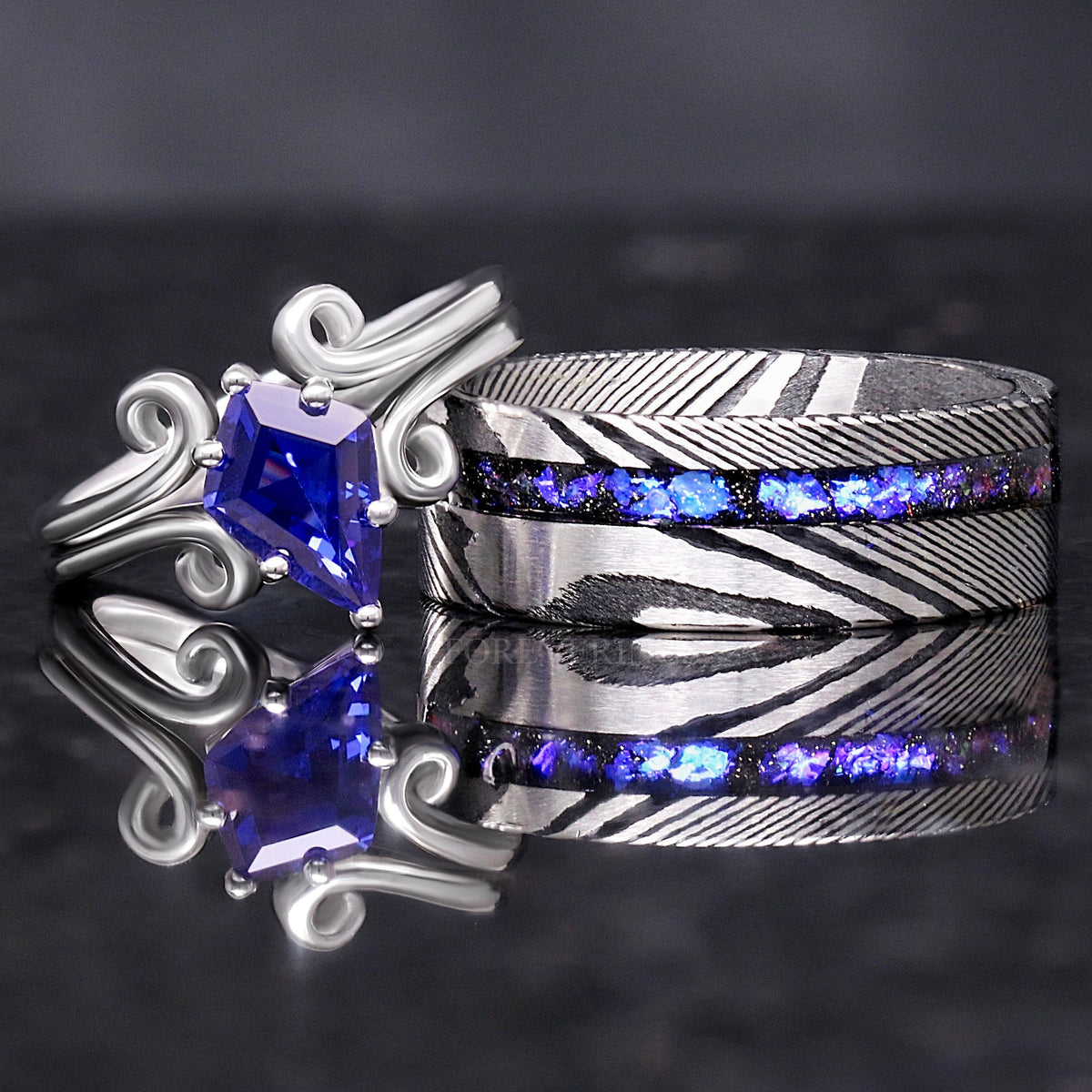 Matching couples ring set, sterling silver kite-cut sapphire ring and 8mm Damascus steel nebula band