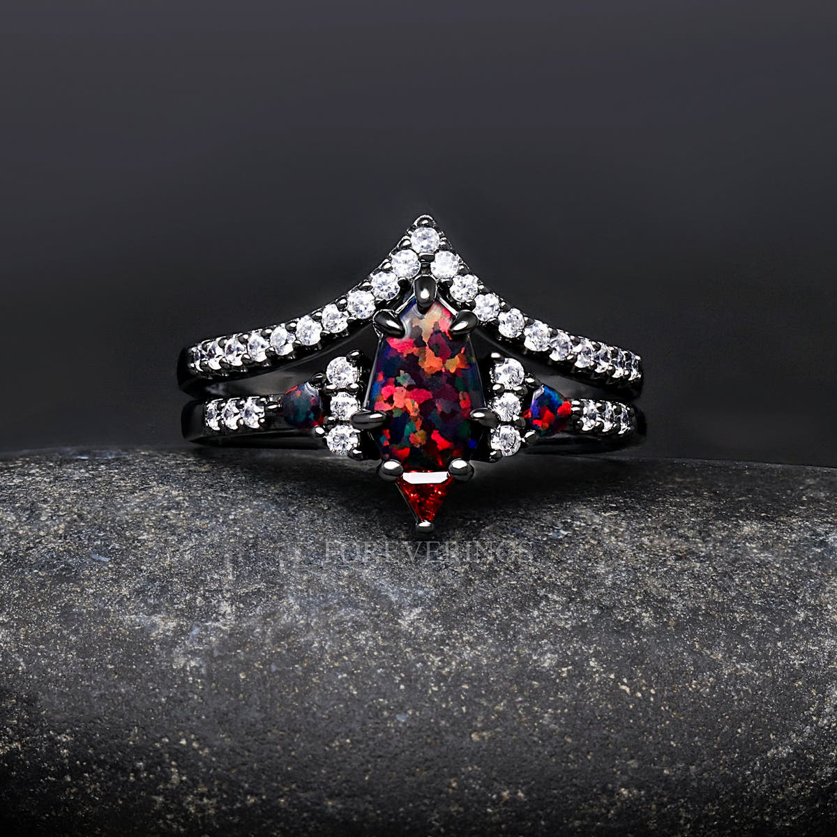 Women's black sterling silver shield-cut fire opal engagement ring and curved band, straight on