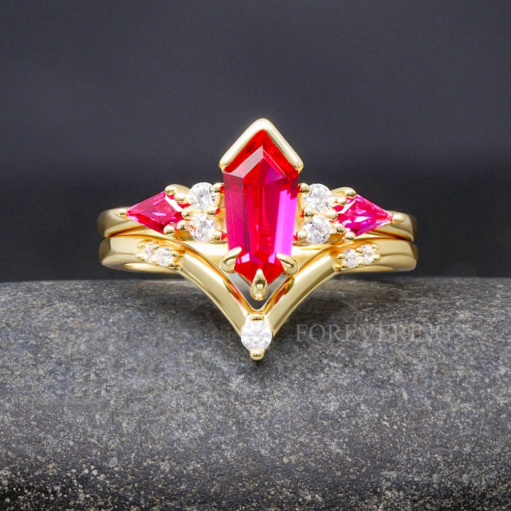 Women's gold sterling silver bridal set with an elongated hexagon ruby, shown straight on