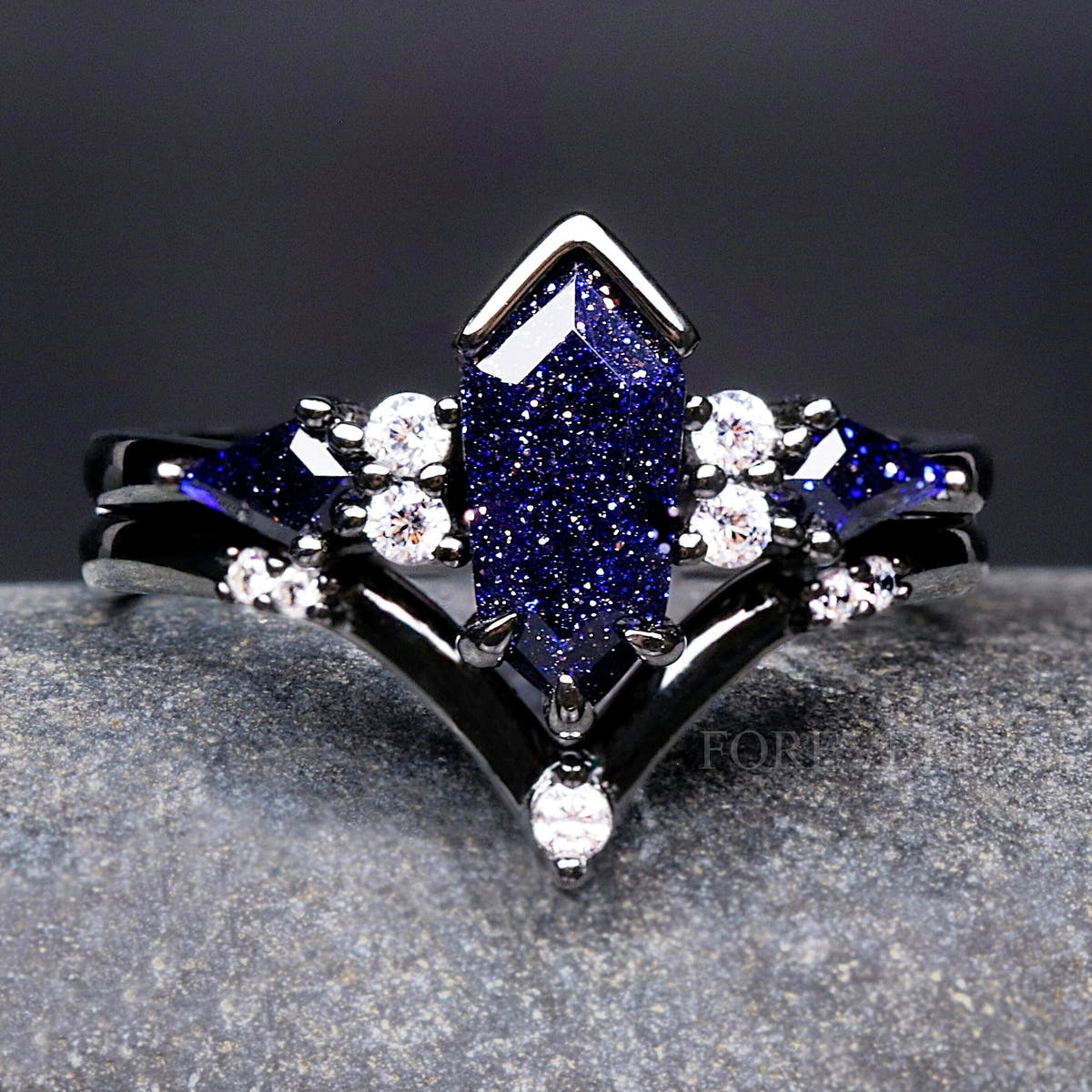 Women's black sterling silver coffin kite blue sandstone bridal set with a curved band, close crop