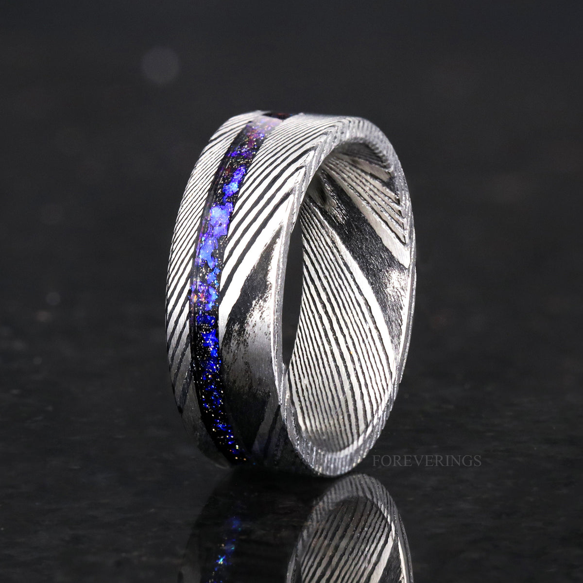 Men's 8mm Damascus steel band with Orion nebula sandstone inlay, standing at an angle