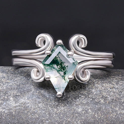 Women's kite-cut moss agate ring on a twirling sterling silver band, shown straight on