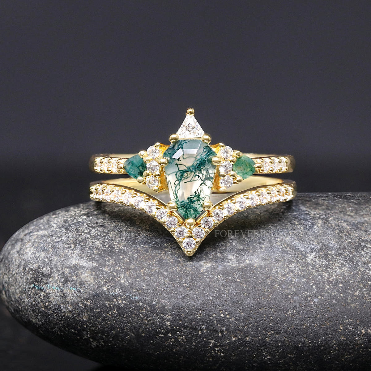 Women's gold sterling silver moss agate engagement ring with a curved pave band, front view