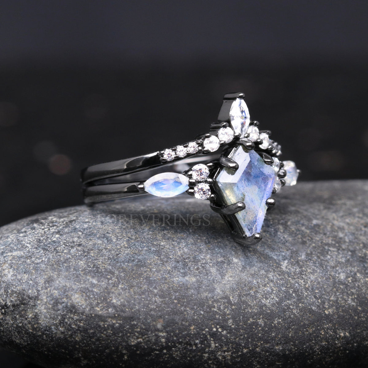 Labradorite engagement ring in black sterling silver, angled view with chevron band