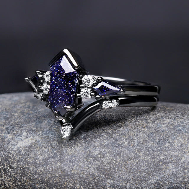 Angled side view of the kite-cut blue sandstone engagement ring and curved black band