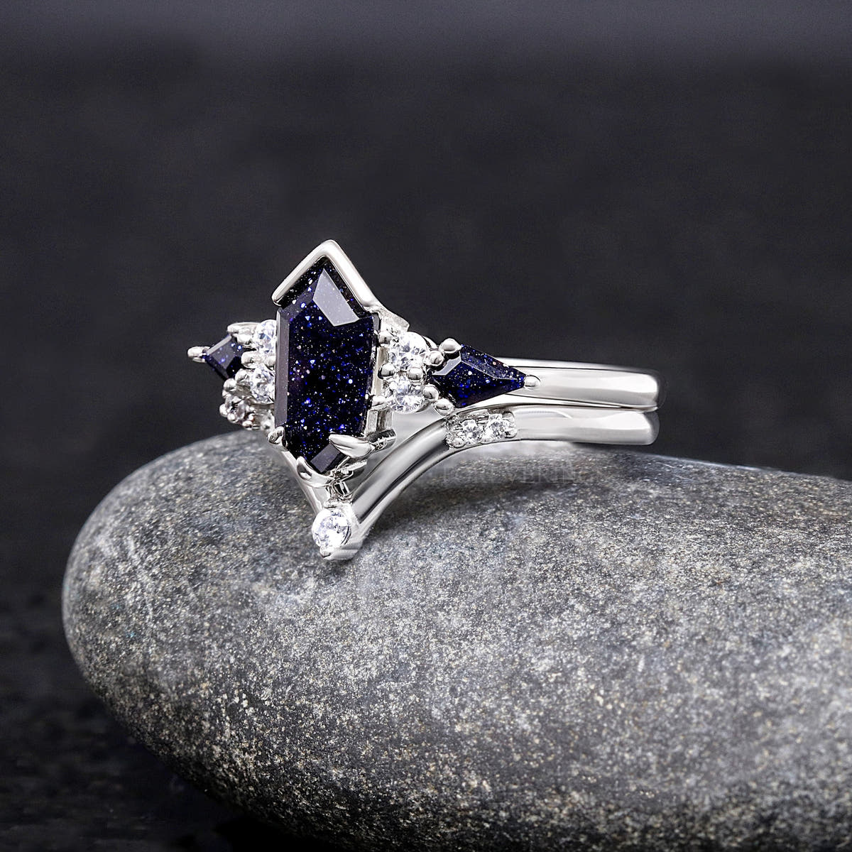 Angled view of the elongated hexagon blue sandstone ring and chevron band