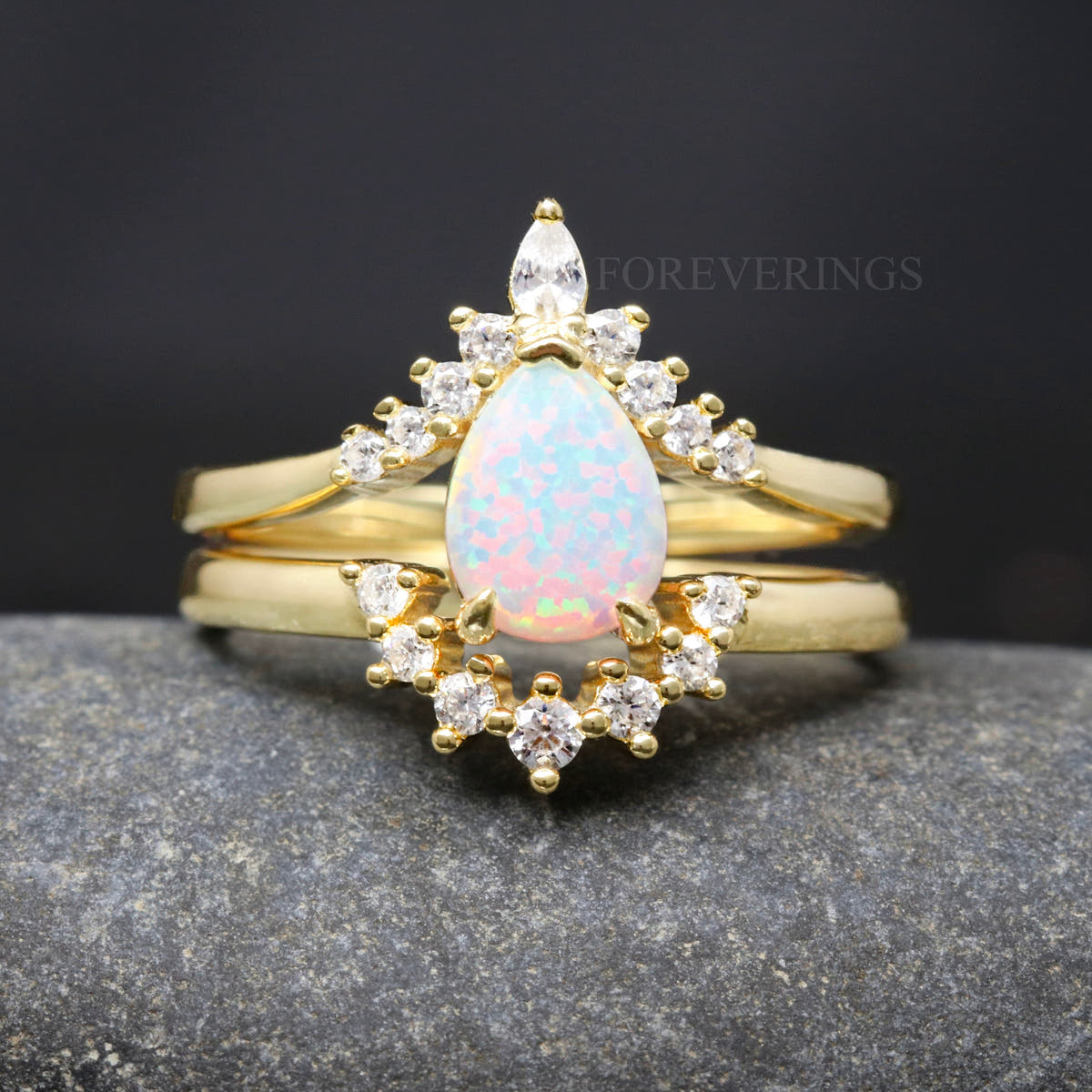 White fire opal bridal set in gold sterling silver, shown straight on in a wider view
