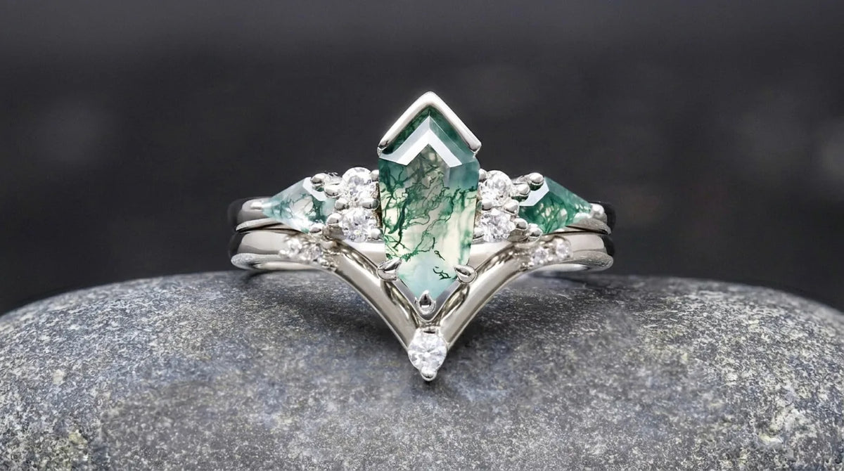 Kite cut moss agate engagement ring set in sterling silver with white accent stones
