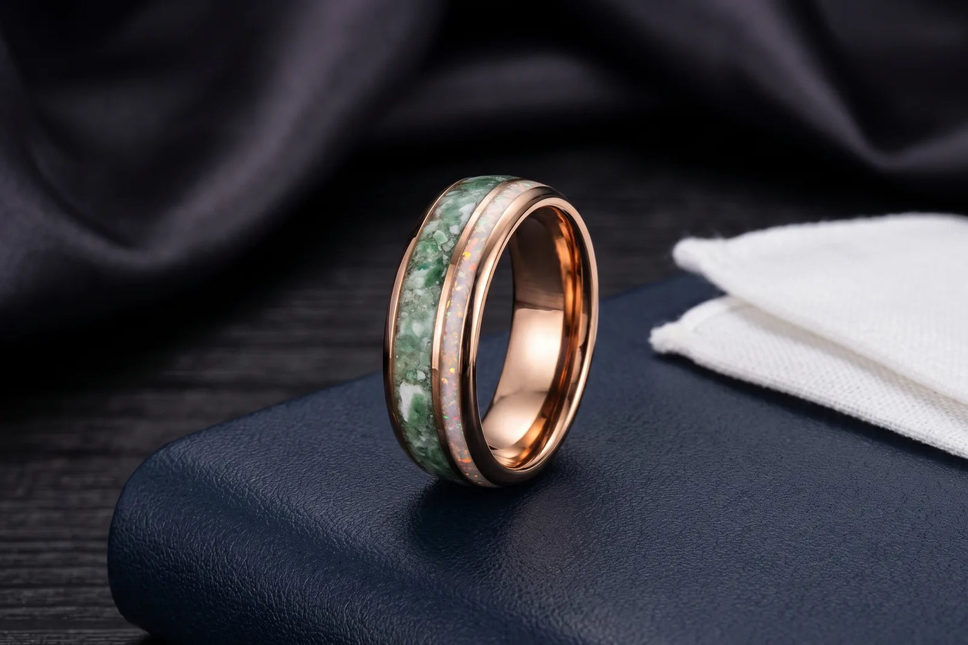 Mens rose gold tungsten wedding band with moss agate and white opal inlays